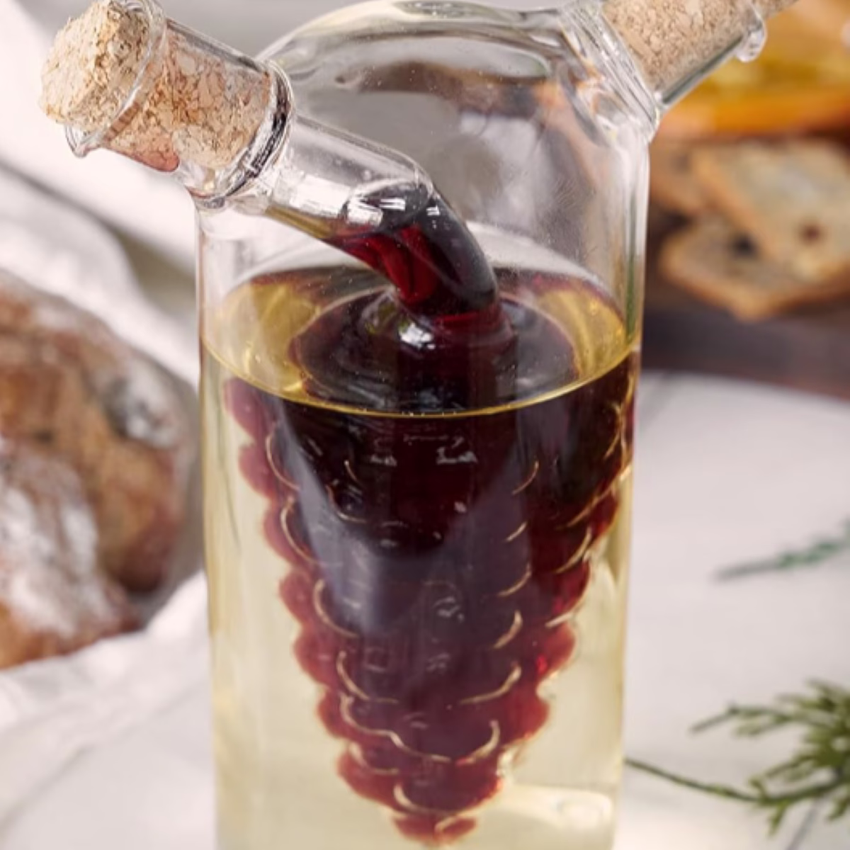 A bottle of wine being poured into a glass