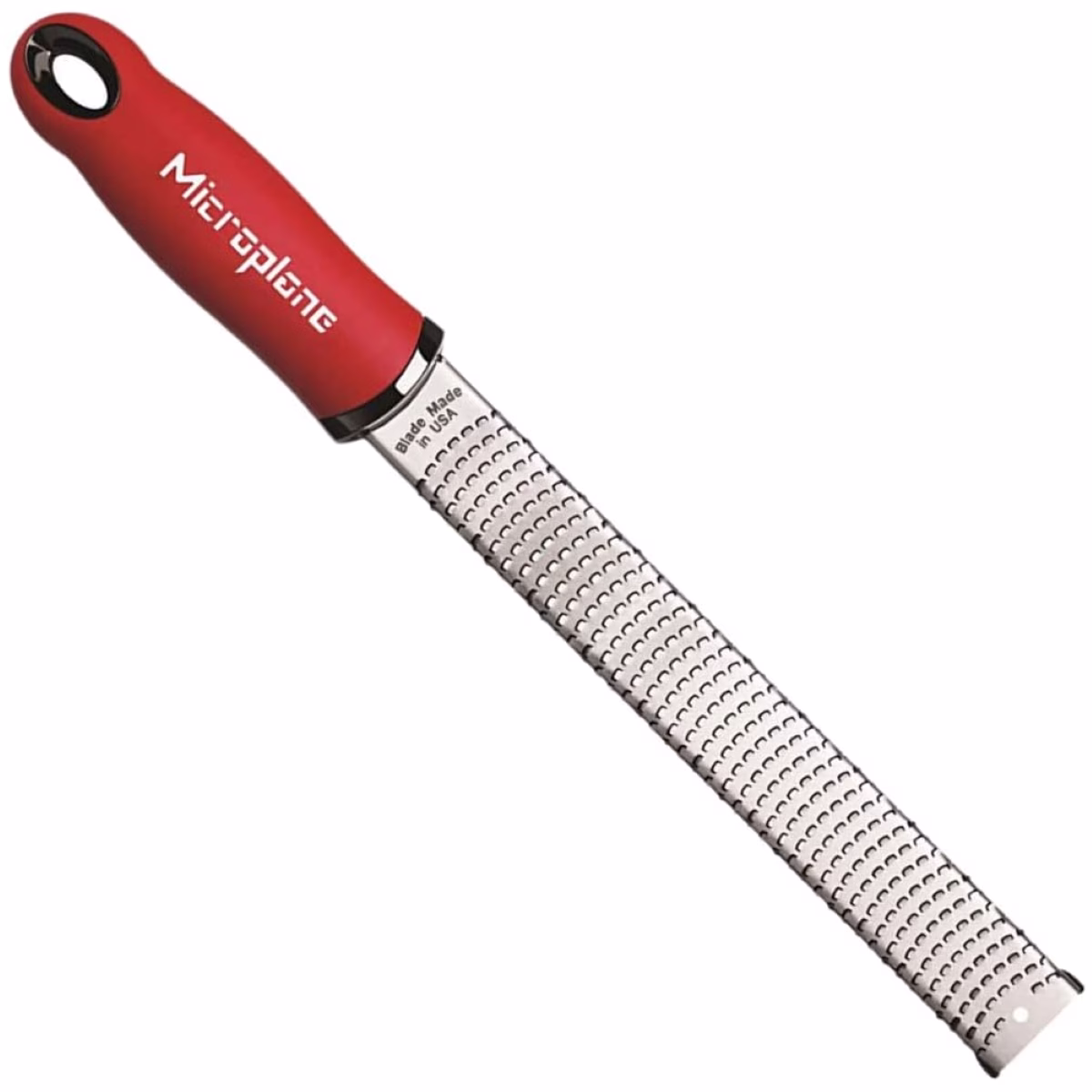 A red grater with a black handle