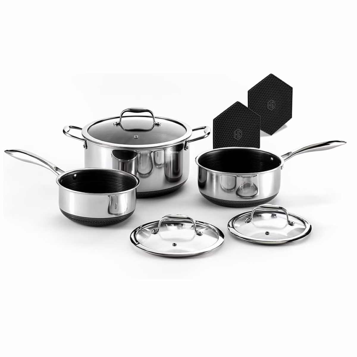 A set of four pots and pans with black lids