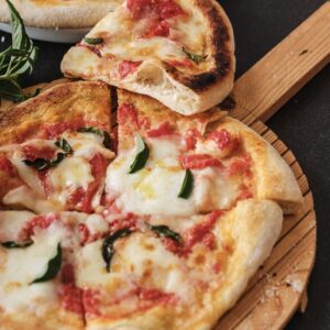 Delicious Italian Margherita pizza with fresh basil, mozzarella, and tomato sauce for authentic Italian cooking ideas.