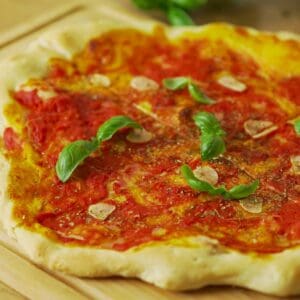 Fresh Marinara pizza with basil and garlic, Italian cooking ideas and recipes.