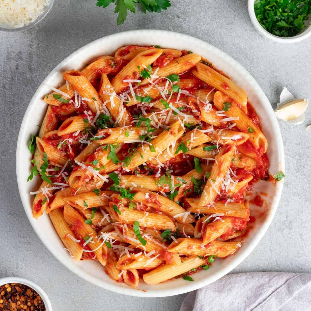Delicious Italian pasta with fresh tomatoes, herbs, and cheese, perfect for authentic penne allarrabbiata