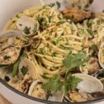 Delicious Italian clam pasta with herbs and fresh clams in authentic spaghetti alle vongole recipe.